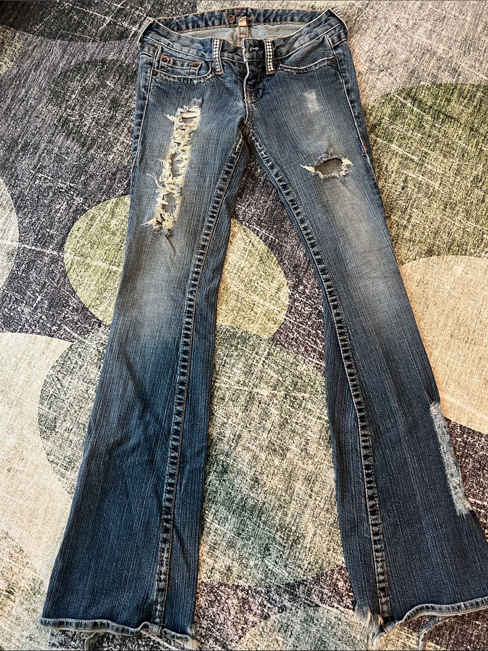 Bebe Bootcut Distressed Flare Jeans in Medium Blue Wash